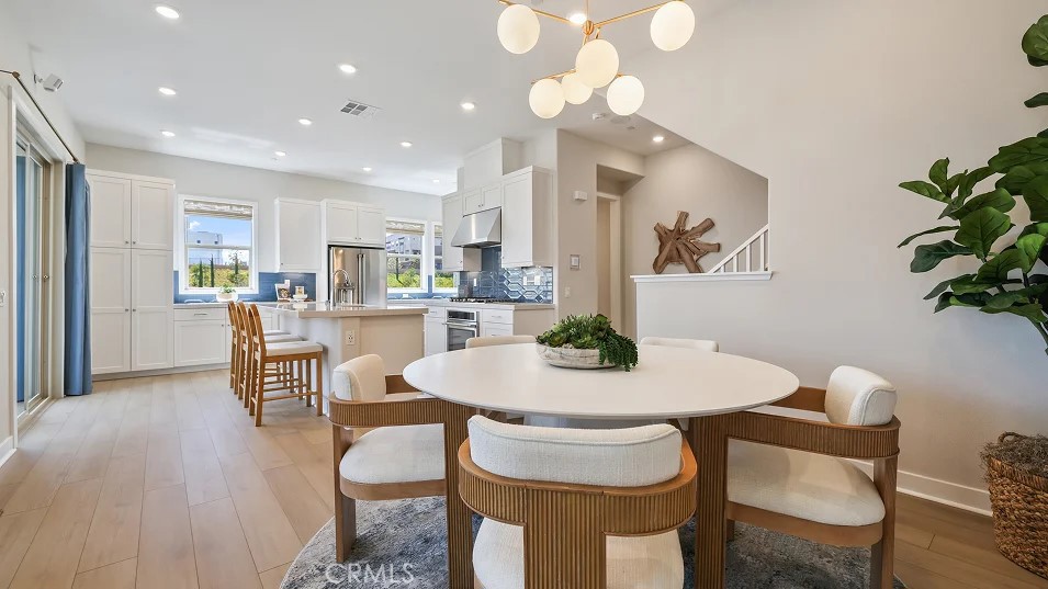 925 Walnut Terrace Montebello, CA 90640 - Photo 8 of 33 a view of a dining room with furniture and wooden floor
