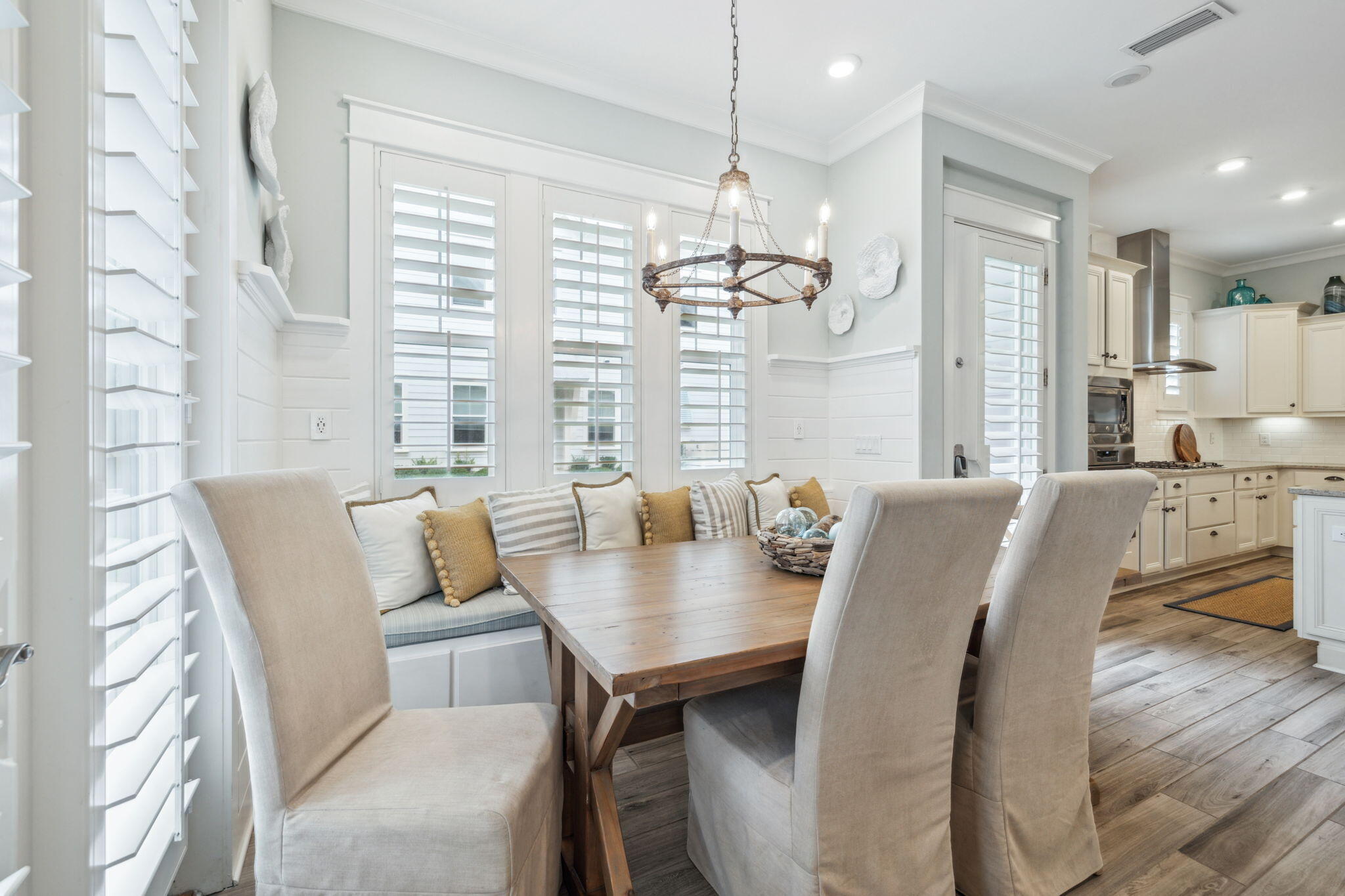 25 Pine Lands Loop East, Unit B Inlet Beach, FL 32461 - Photo 11 of 37 a view of a dining room with furniture wooden floor and chandelier