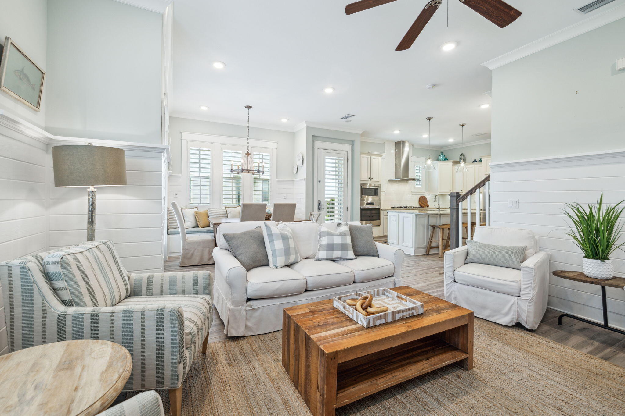 25 Pine Lands Loop East, Unit B Inlet Beach, FL 32461 - Photo 13 of 37 a living room with furniture a rug and a chandelier