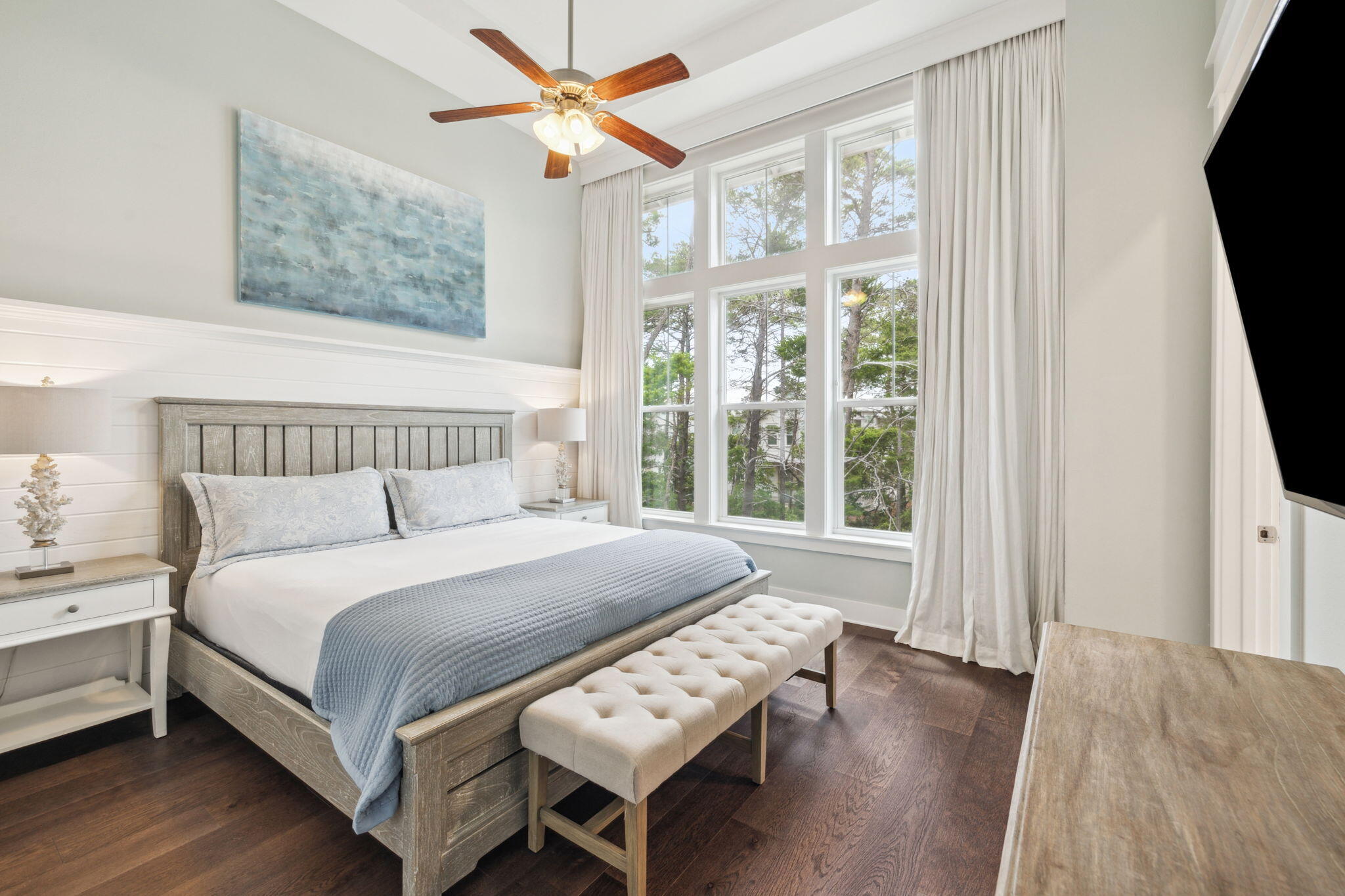 25 Pine Lands Loop East, Unit B Inlet Beach, FL 32461 - Photo 14 of 37 a bedroom with a bed and a flat tv screen on a dresser