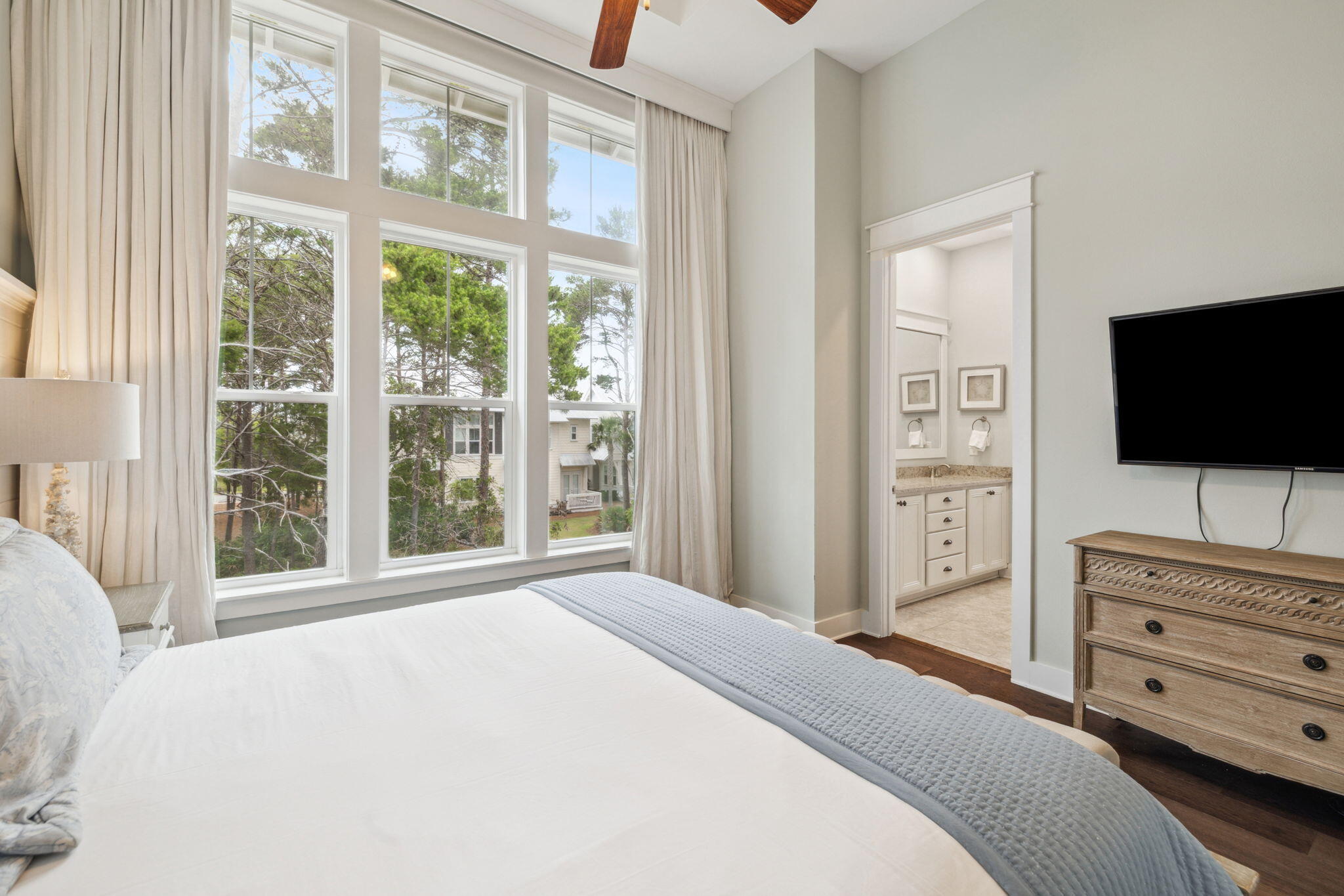 25 Pine Lands Loop East, Unit B Inlet Beach, FL 32461 - Photo 15 of 37 a bedroom with a bed and a flat screen tv