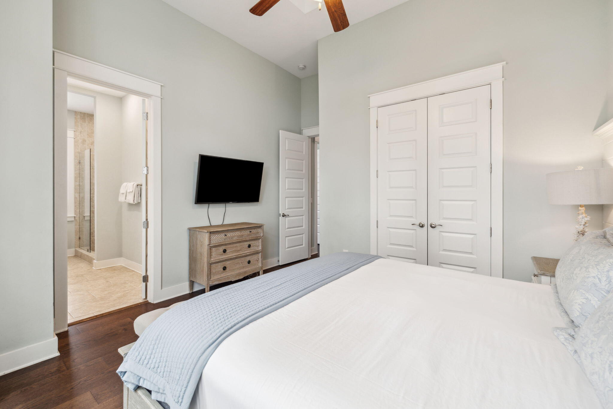 25 Pine Lands Loop East, Unit B Inlet Beach, FL 32461 - Photo 16 of 37 a bedroom with a bed and a flat screen tv