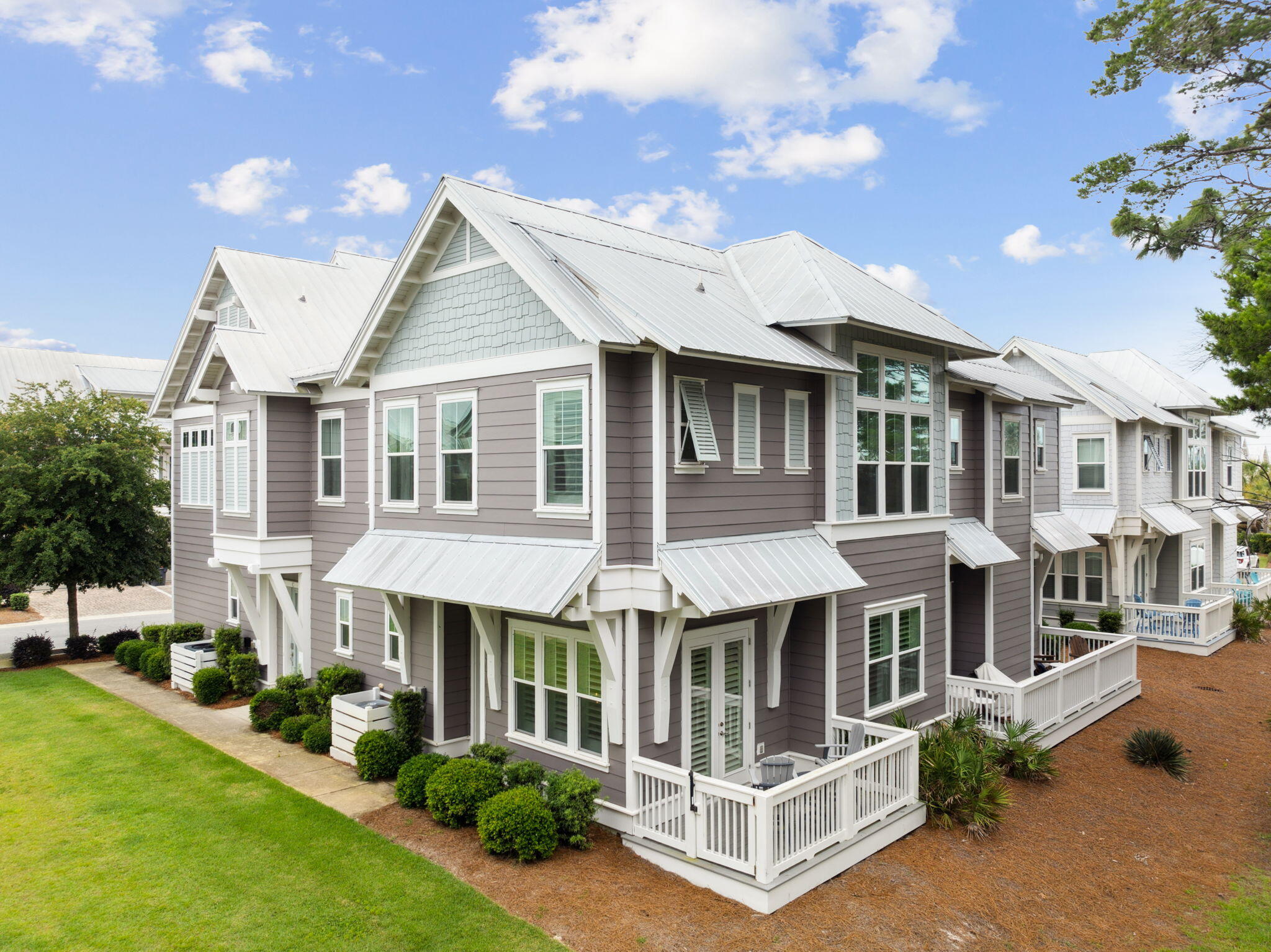 25 Pine Lands Loop East, Unit B Inlet Beach, FL 32461 - Photo 2 of 37 a view of residential houses with yard and furniture