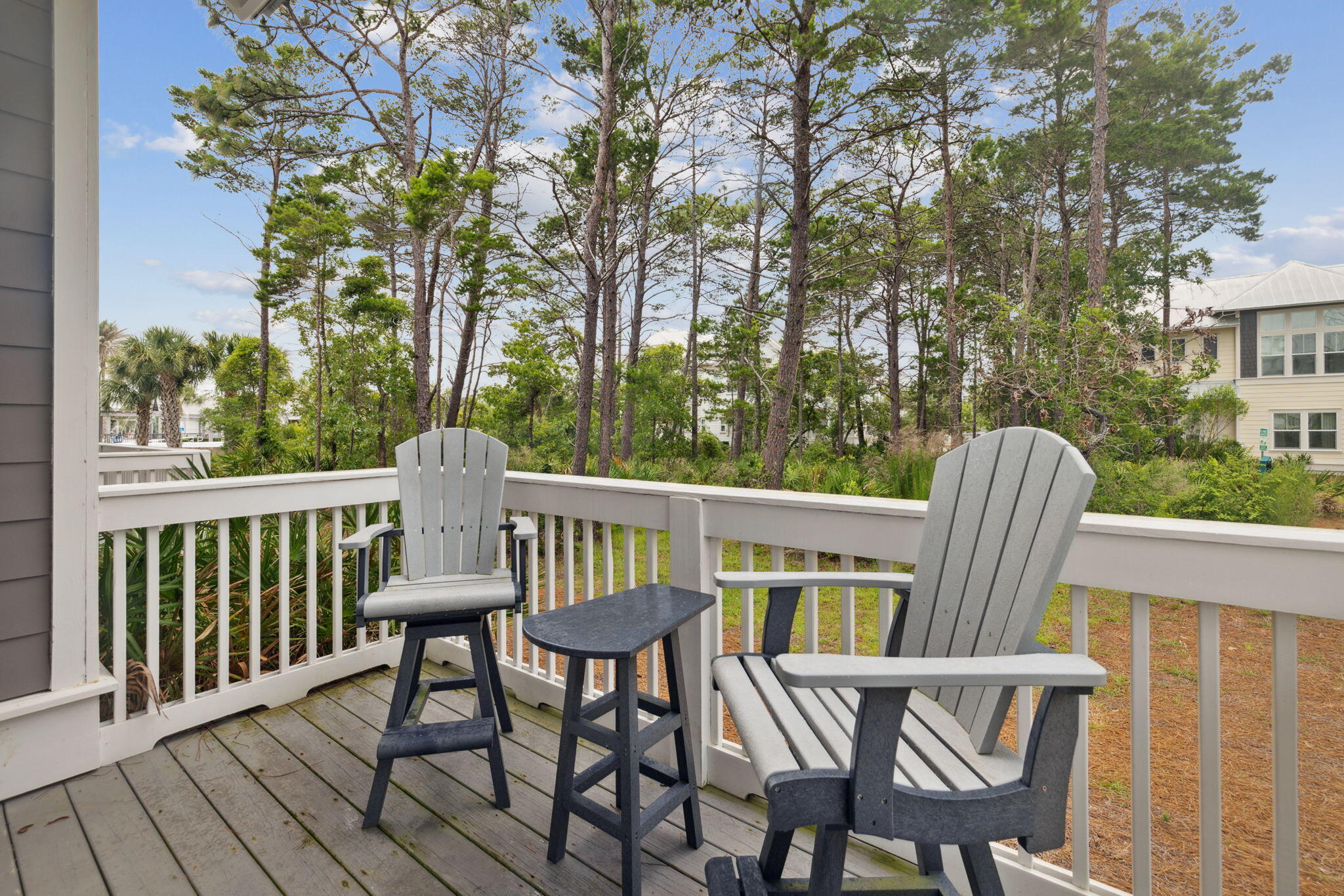 25 Pine Lands Loop East, Unit B Inlet Beach, FL 32461 - Photo 22 of 37 a view of a chairs and table in the balcony