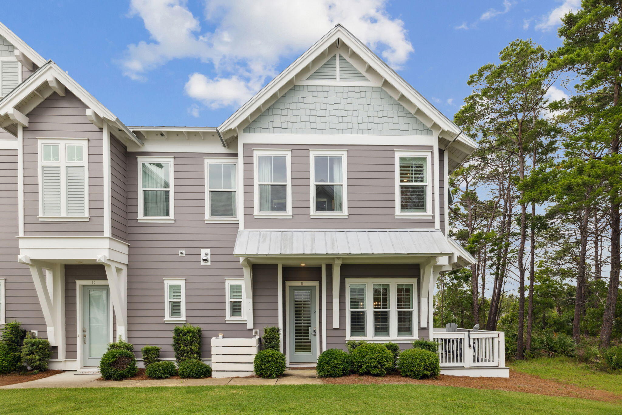 25 Pine Lands Loop East, Unit B Inlet Beach, FL 32461 - Photo 32 of 37 a front view of a house with a yard