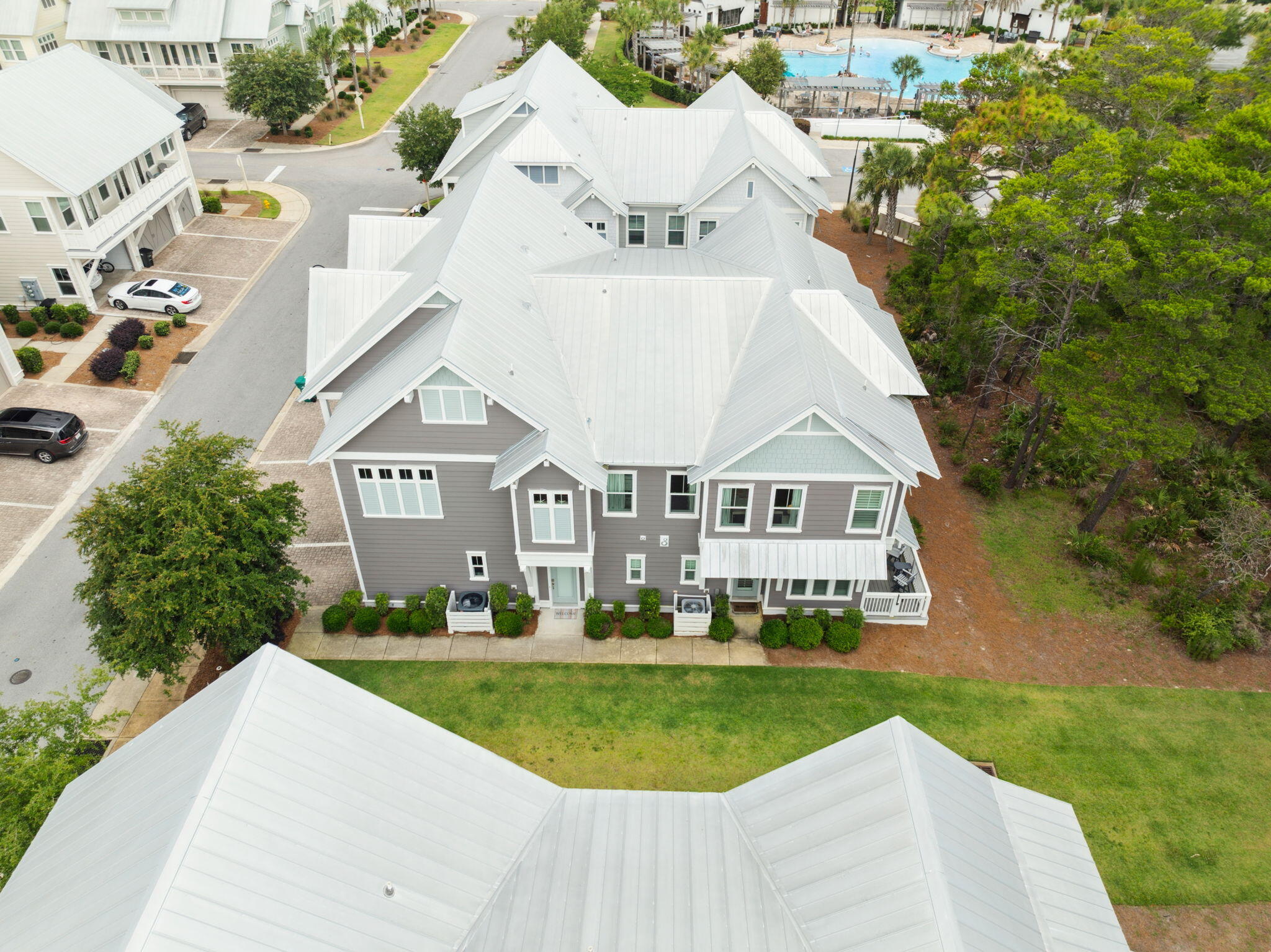 25 Pine Lands Loop East, Unit B Inlet Beach, FL 32461 - Photo 37 of 37 a aerial view of a house with a yard table and chairs