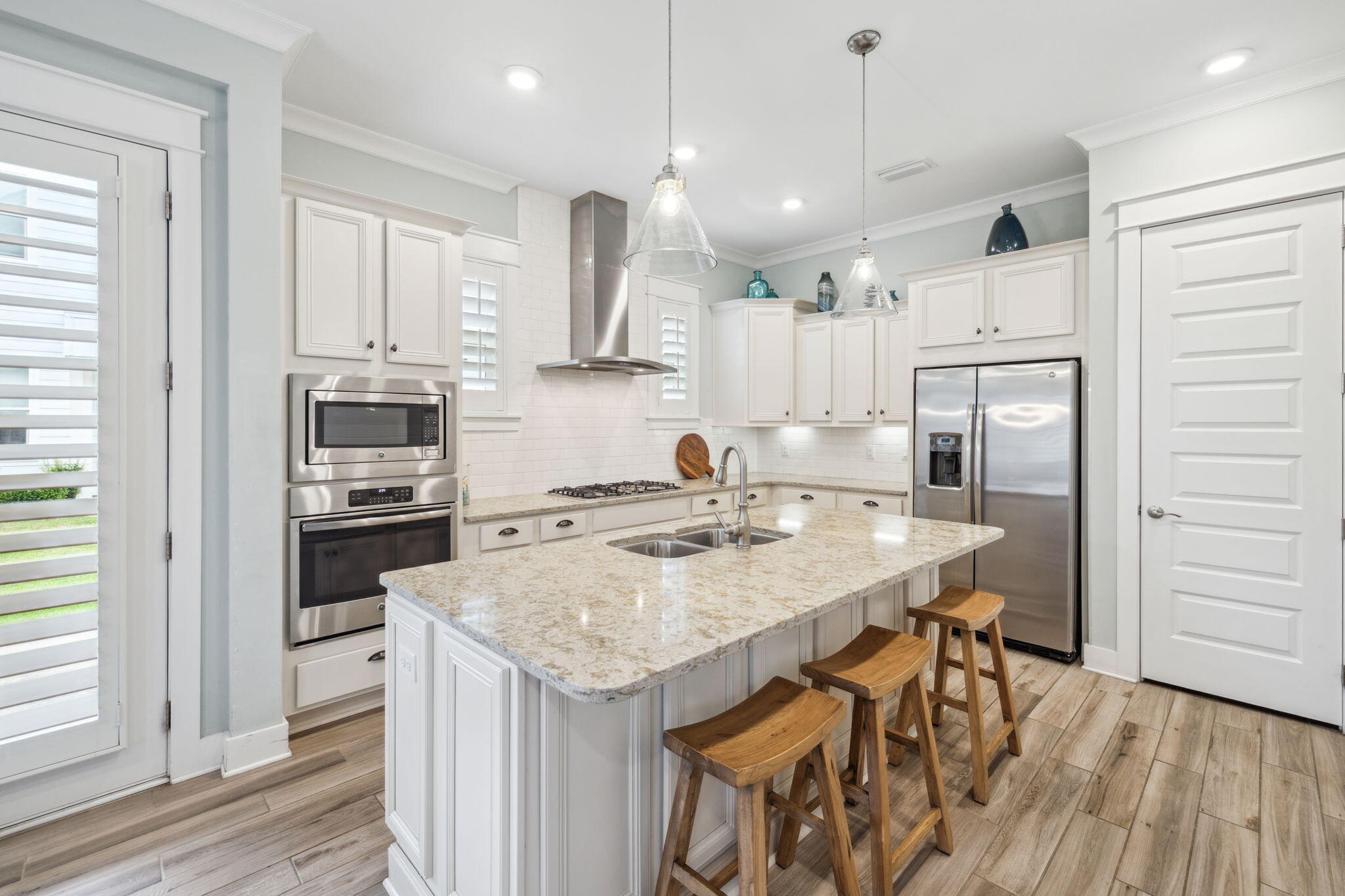 25 Pine Lands Loop East, Unit B Inlet Beach, FL 32461 - Photo 5 of 37 a kitchen with a center island appliances and cabinets