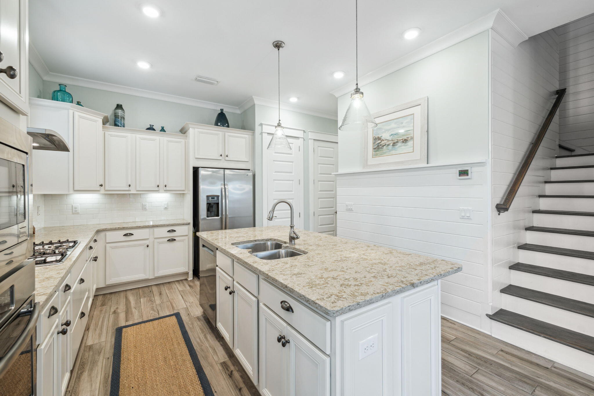 25 Pine Lands Loop East, Unit B Inlet Beach, FL 32461 - Photo 8 of 37 a kitchen with white cabinets and appliances