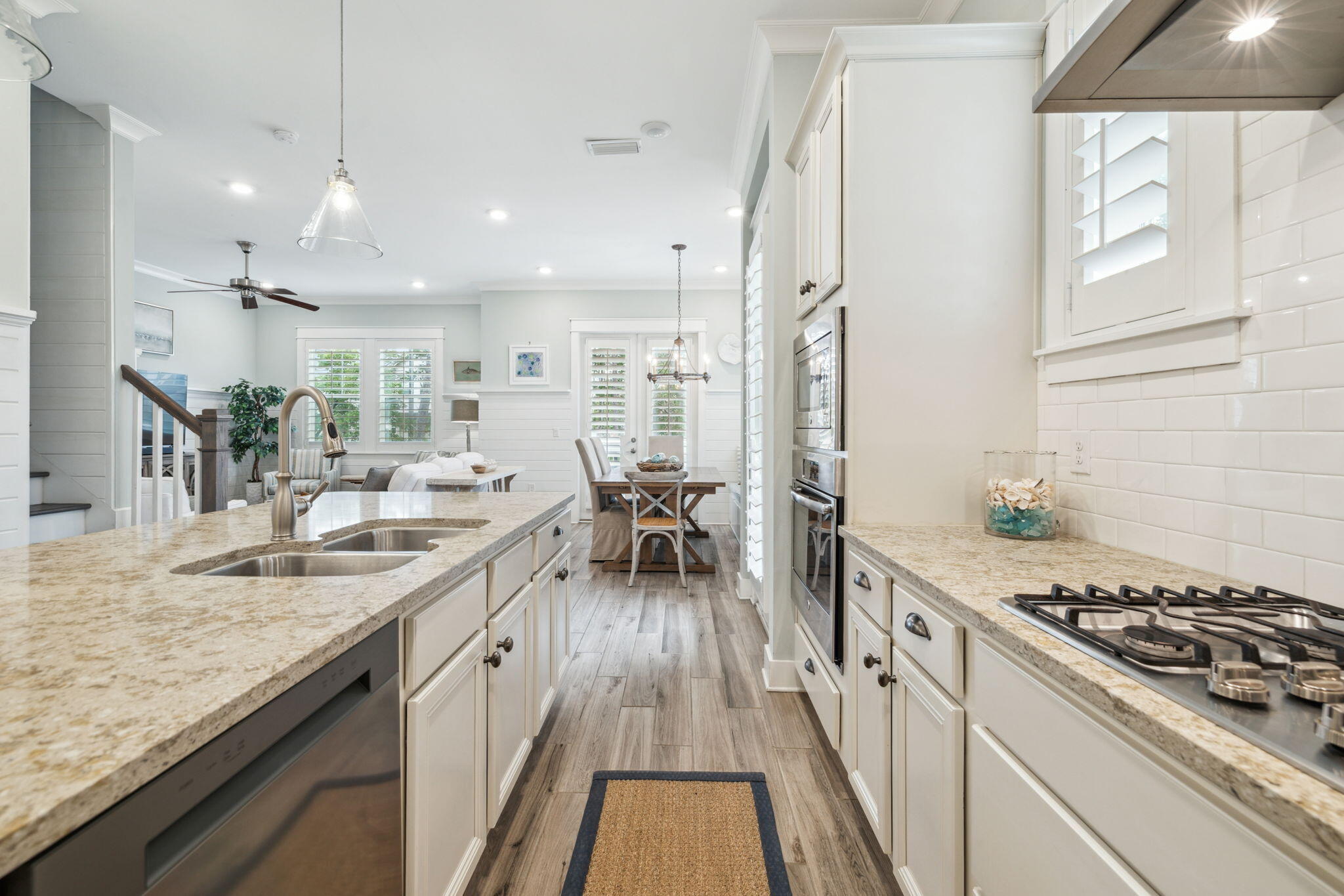 25 Pine Lands Loop East, Unit B Inlet Beach, FL 32461 - Photo 9 of 37 a kitchen with kitchen island granite countertop a stove a sink and a refrigerator