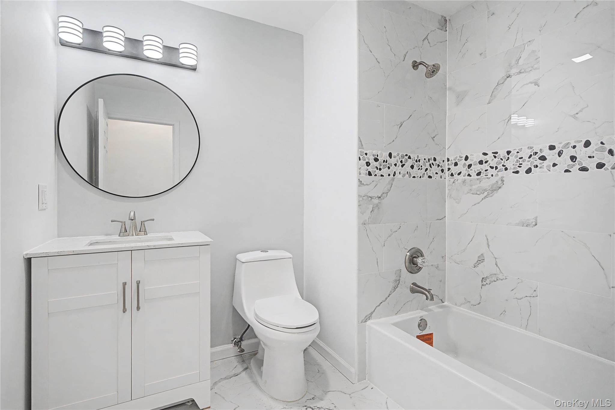 25 Clinton Street Middletown, NY 10940 - Photo 25 of 38 a bathroom with a toilet a sink and a bathtub