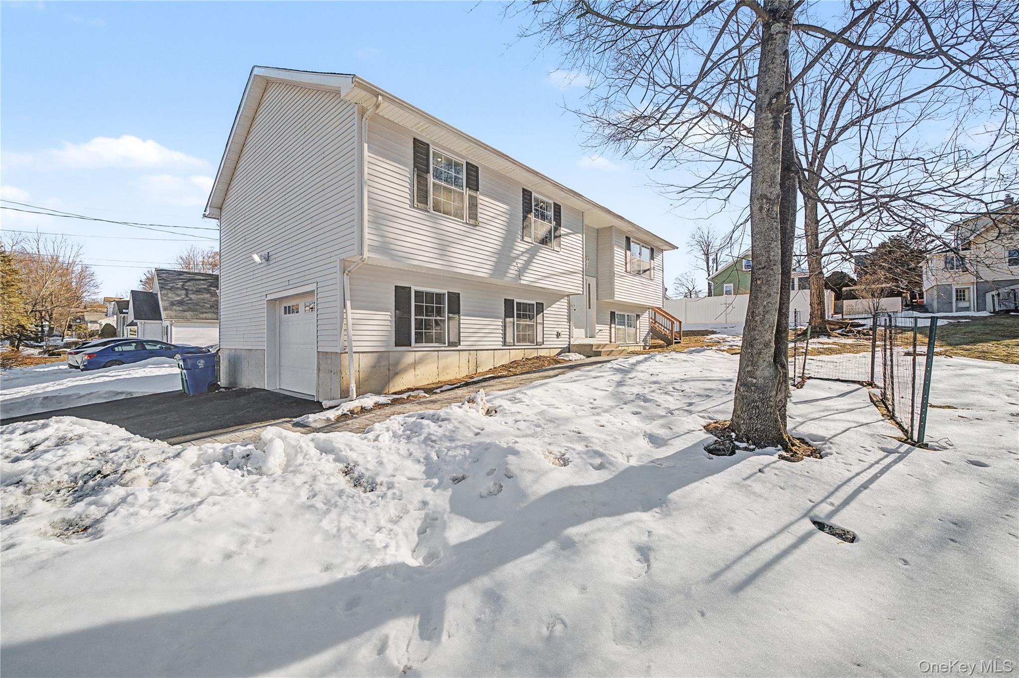 25 Clinton Street Middletown, NY 10940 - Photo 4 of 38 a view of a building with snow on the road