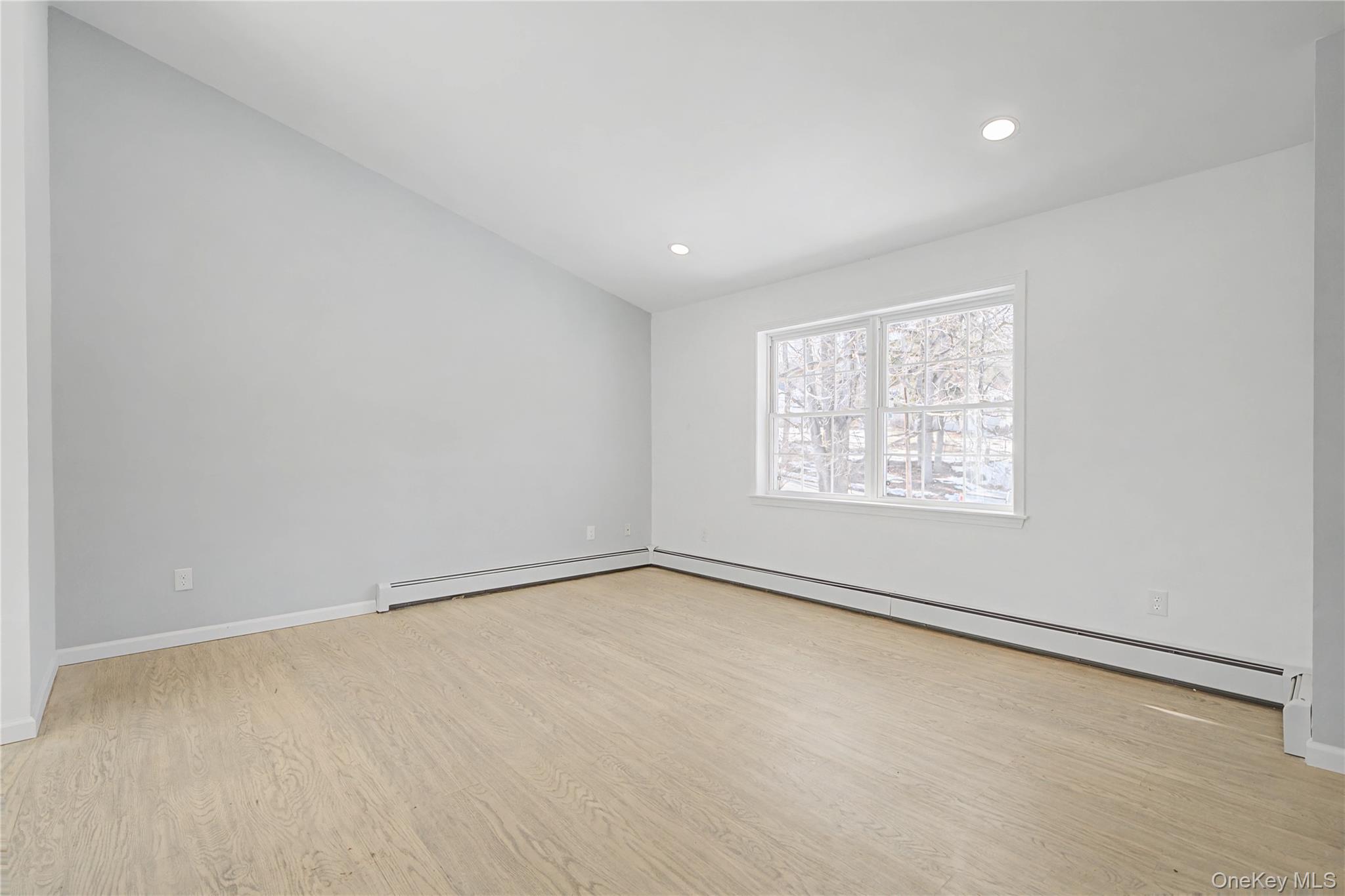 25 Clinton Street Middletown, NY 10940 - Photo 7 of 38 an empty room with a empty space and windows