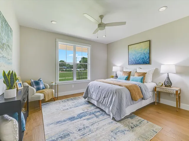 a bedroom with a large bed and a couch