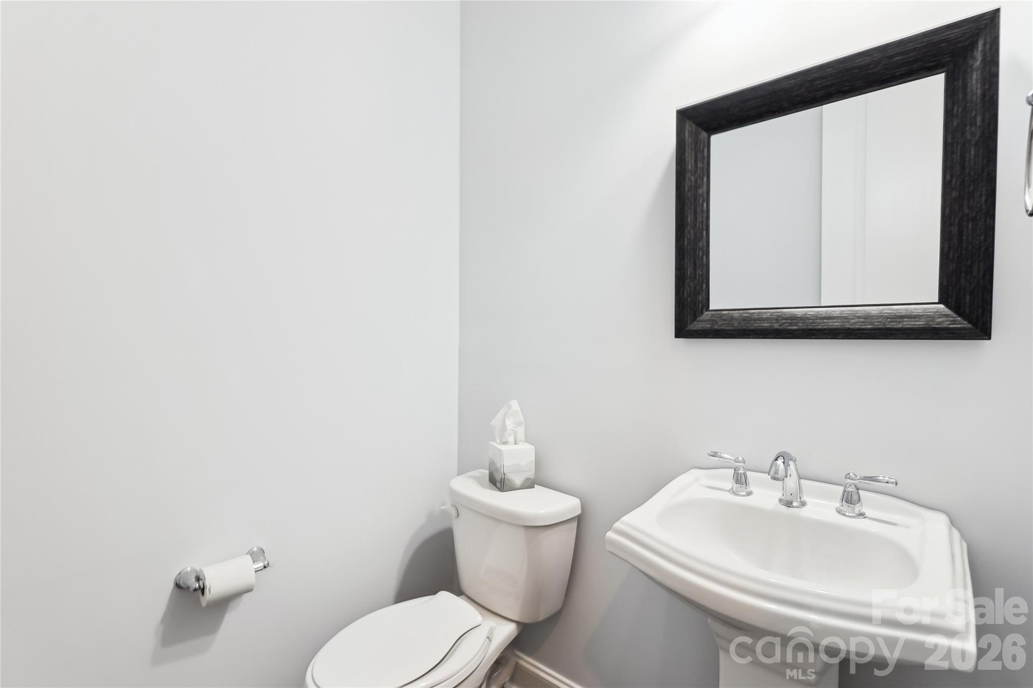 657 Chase Court Fort Mill, SC 29708 - Photo 11 of 39 a bathroom with a toilet sink and mirror