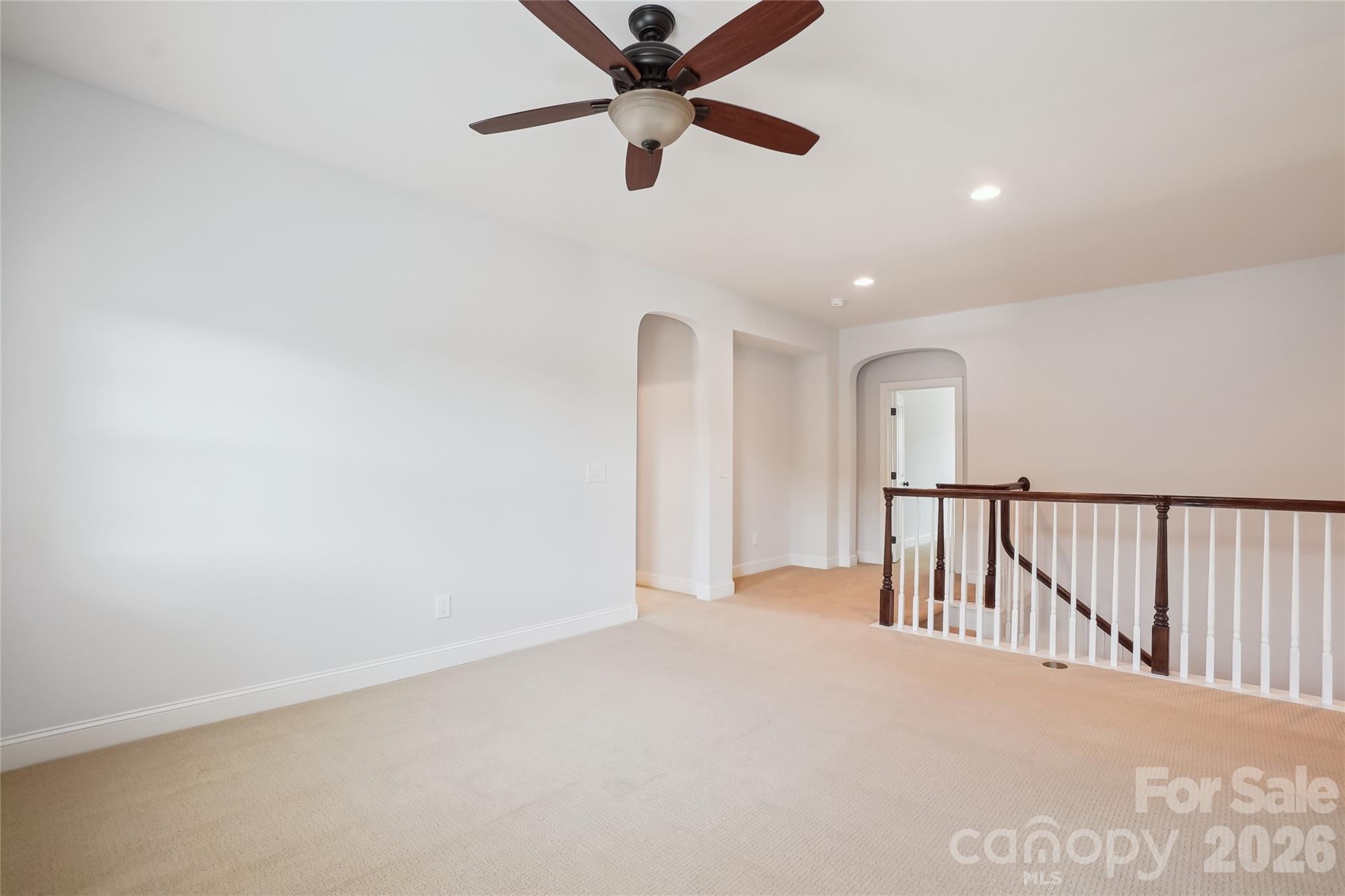 657 Chase Court Fort Mill, SC 29708 - Photo 18 of 39 a view of a hallway with a ceiling fan