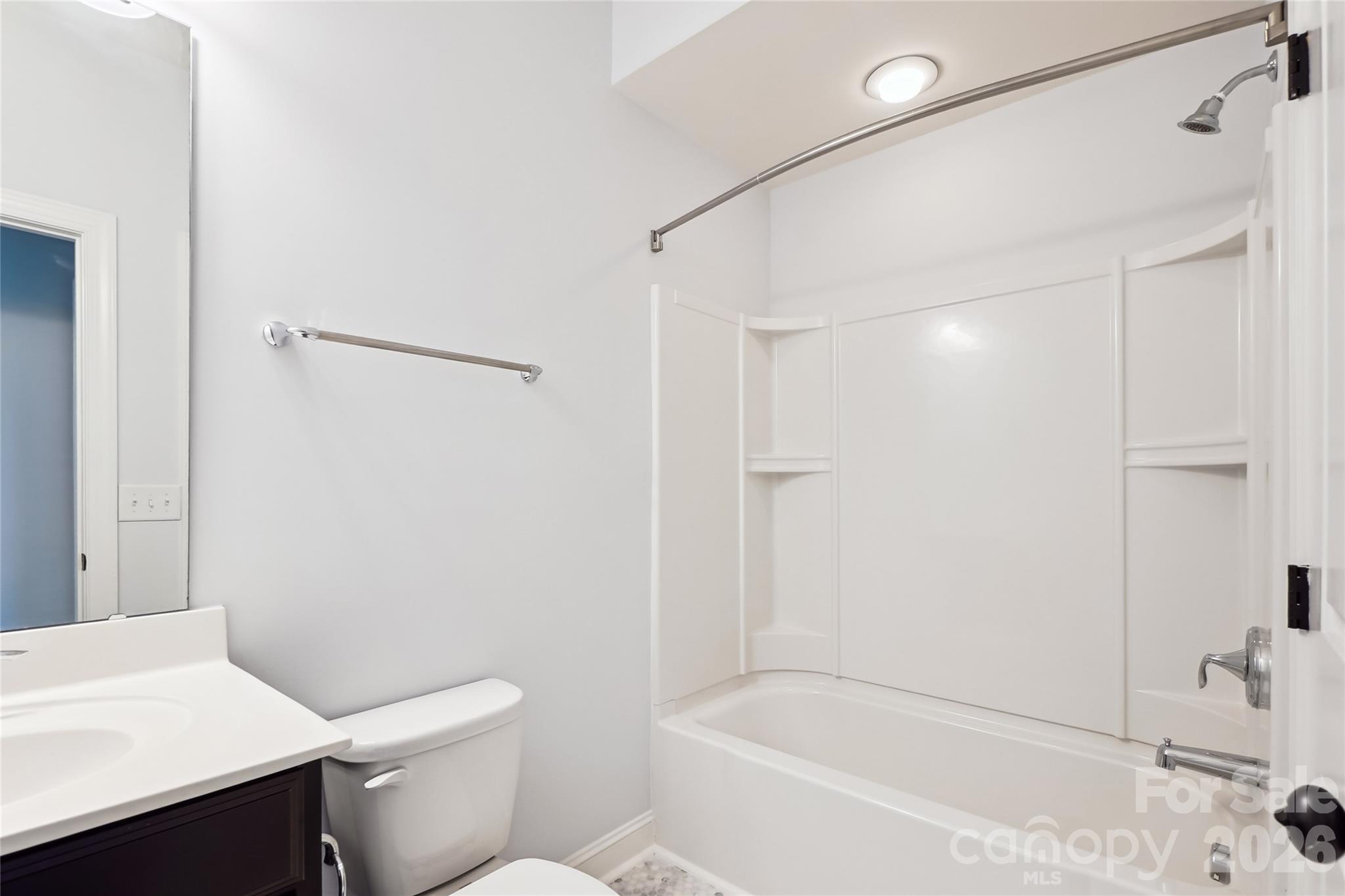 657 Chase Court Fort Mill, SC 29708 - Photo 28 of 39 a white toilet sitting next to a bath tub shower