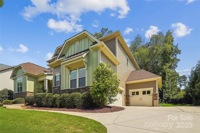 a view of house with yard and green space
