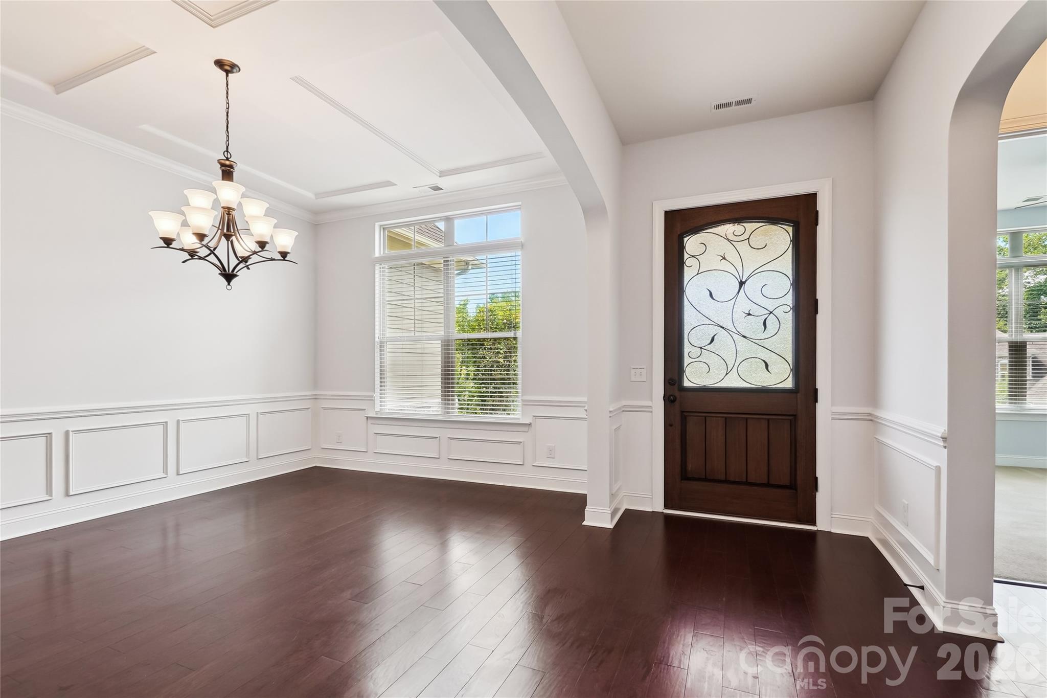 657 Chase Court Fort Mill, SC 29708 - Photo 4 of 39 a view of a room with wooden floor and a window