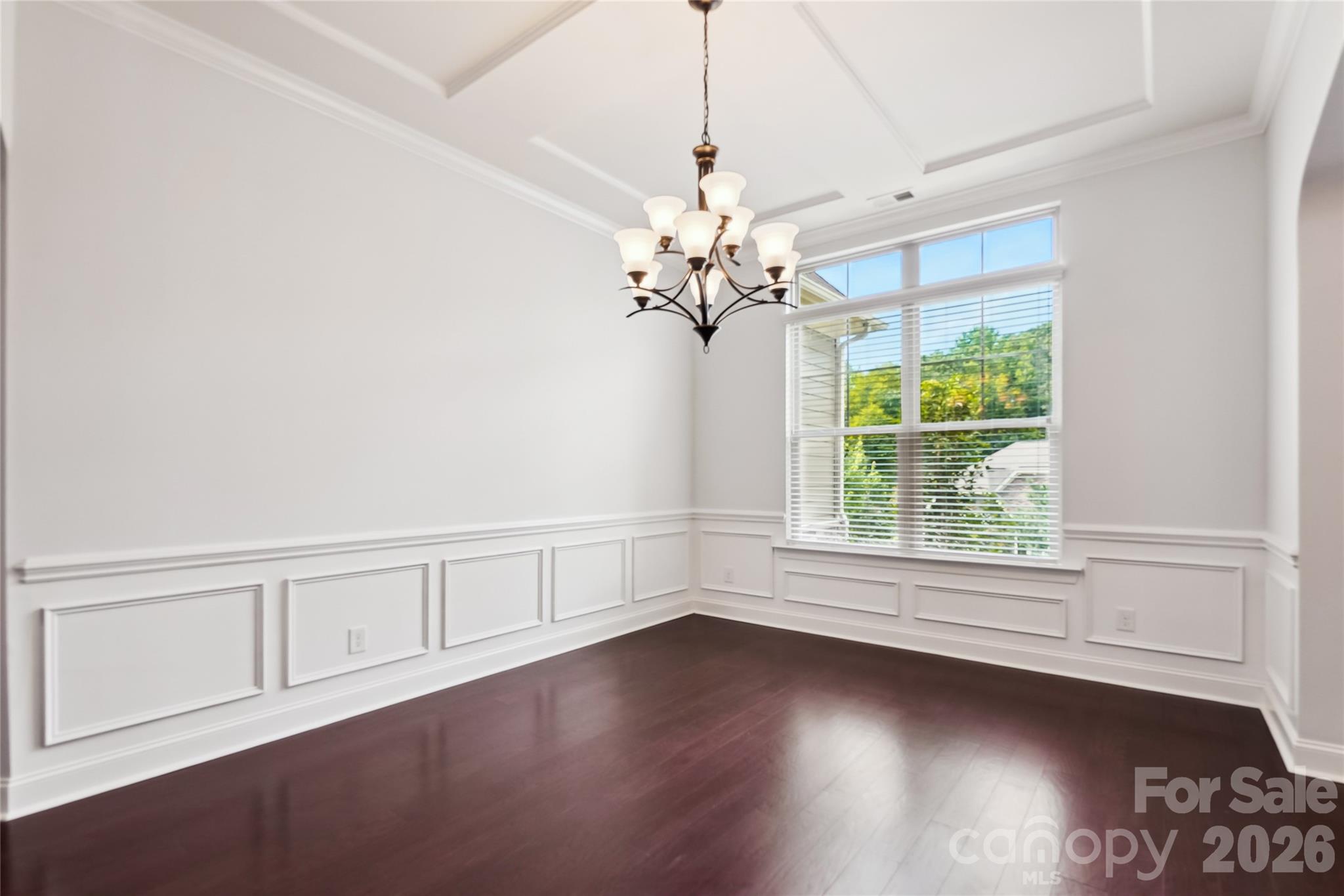 657 Chase Court Fort Mill, SC 29708 - Photo 5 of 39 an empty room with wooden floor and windows
