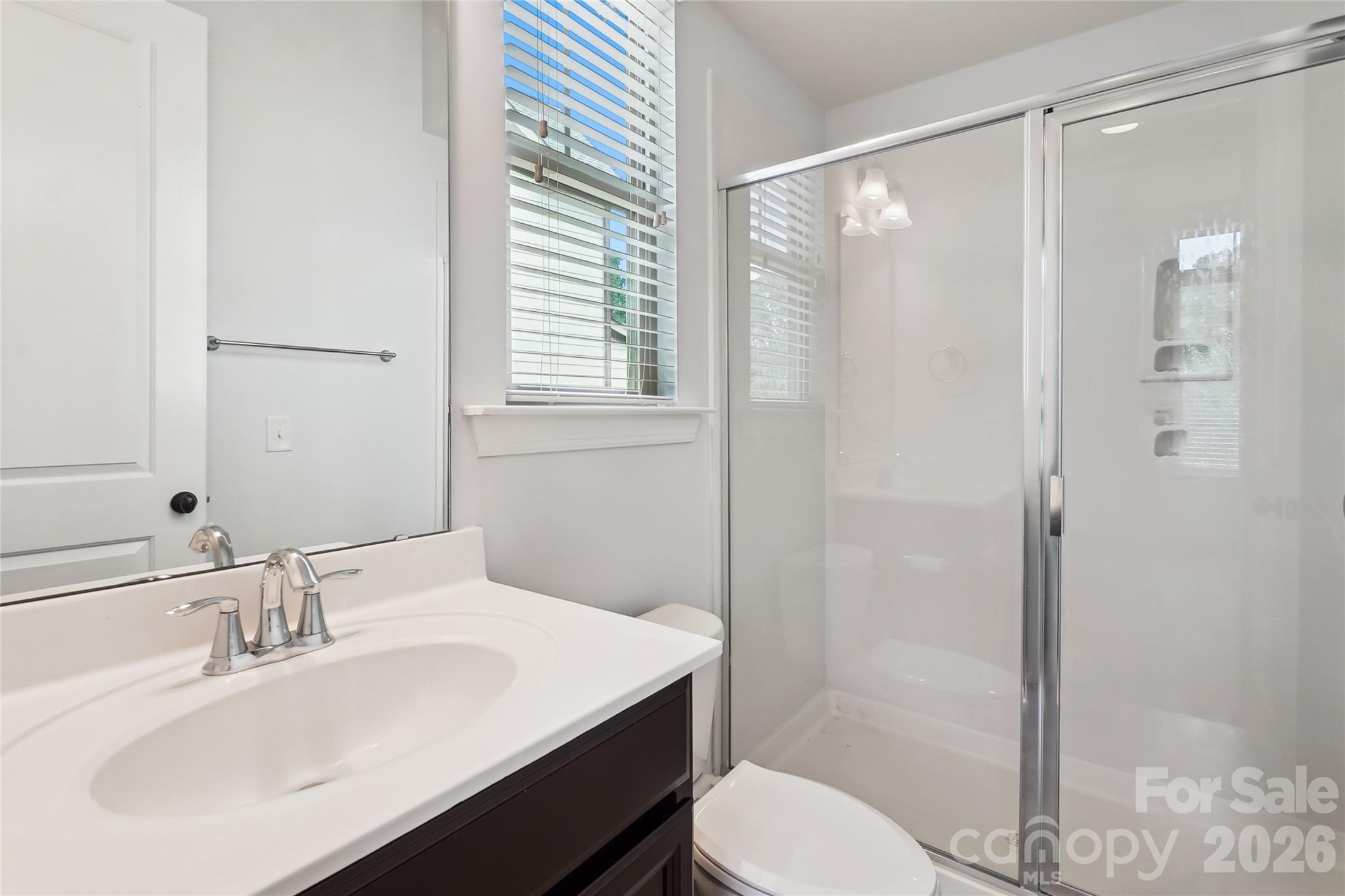 657 Chase Court Fort Mill, SC 29708 - Photo 9 of 39 a bathroom with a sink toilet and shower