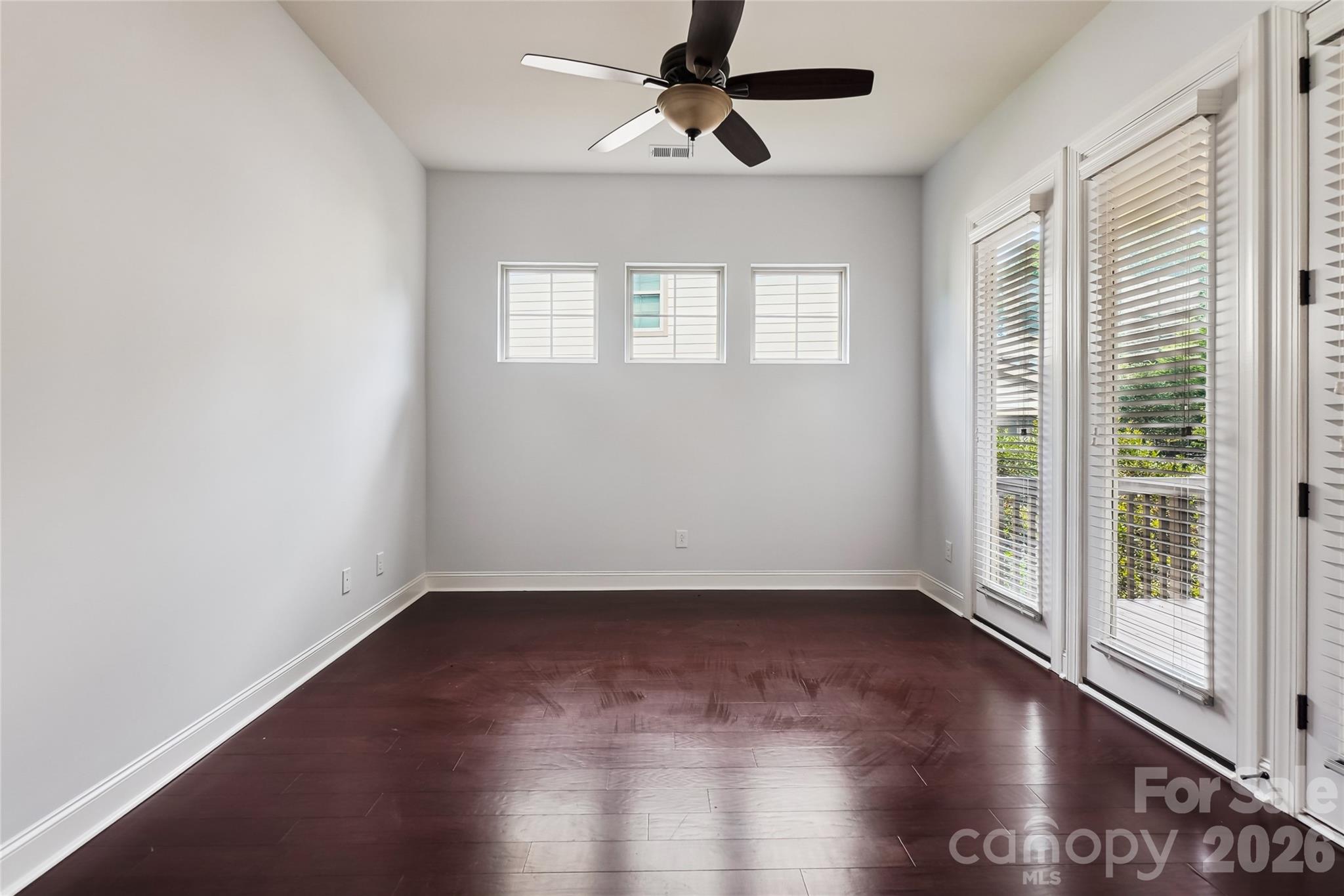 657 Chase Court Fort Mill, SC 29708 - Photo 10 of 39 wooden floor in an empty room with a window