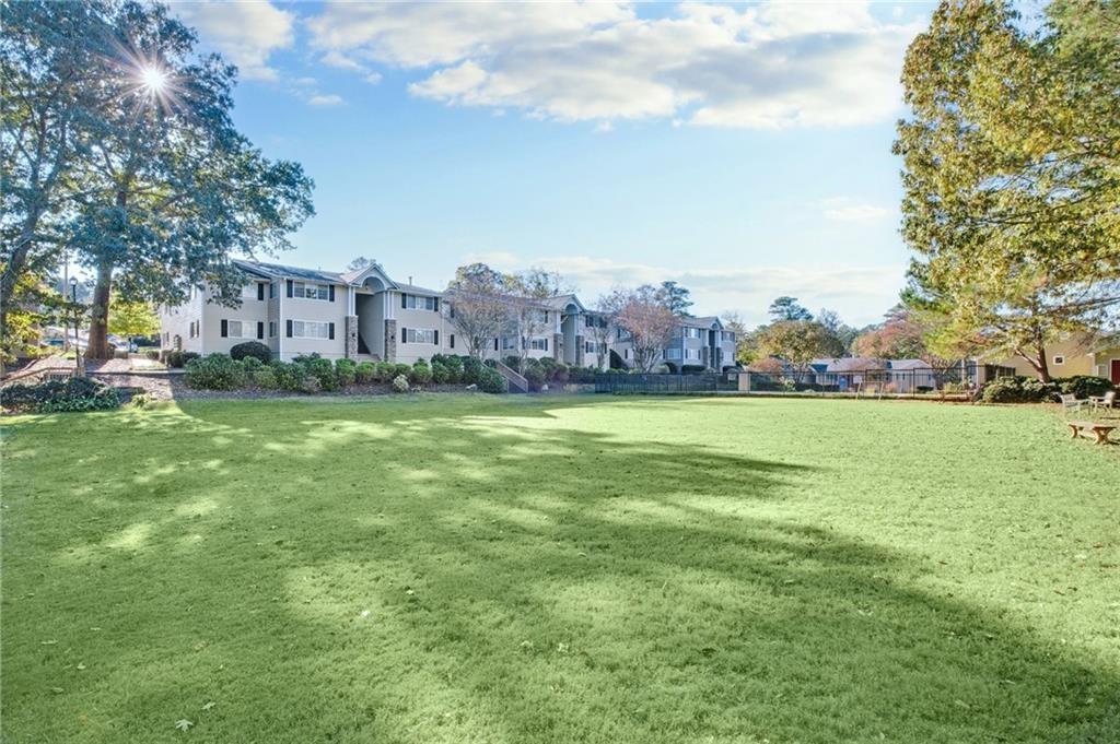 1468 Briarwood Road Northeast, Unit 303 Brookhaven, GA 30319 - Photo 32 of 32 a view of a field of grass and trees