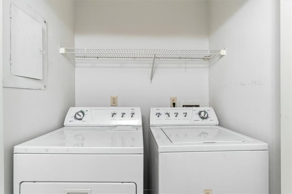 1468 Briarwood Road Northeast, Unit 303 Brookhaven, GA 30319 - Photo 9 of 32 a utility room with dryer and washer