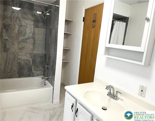 a bathroom with a sink and a tub