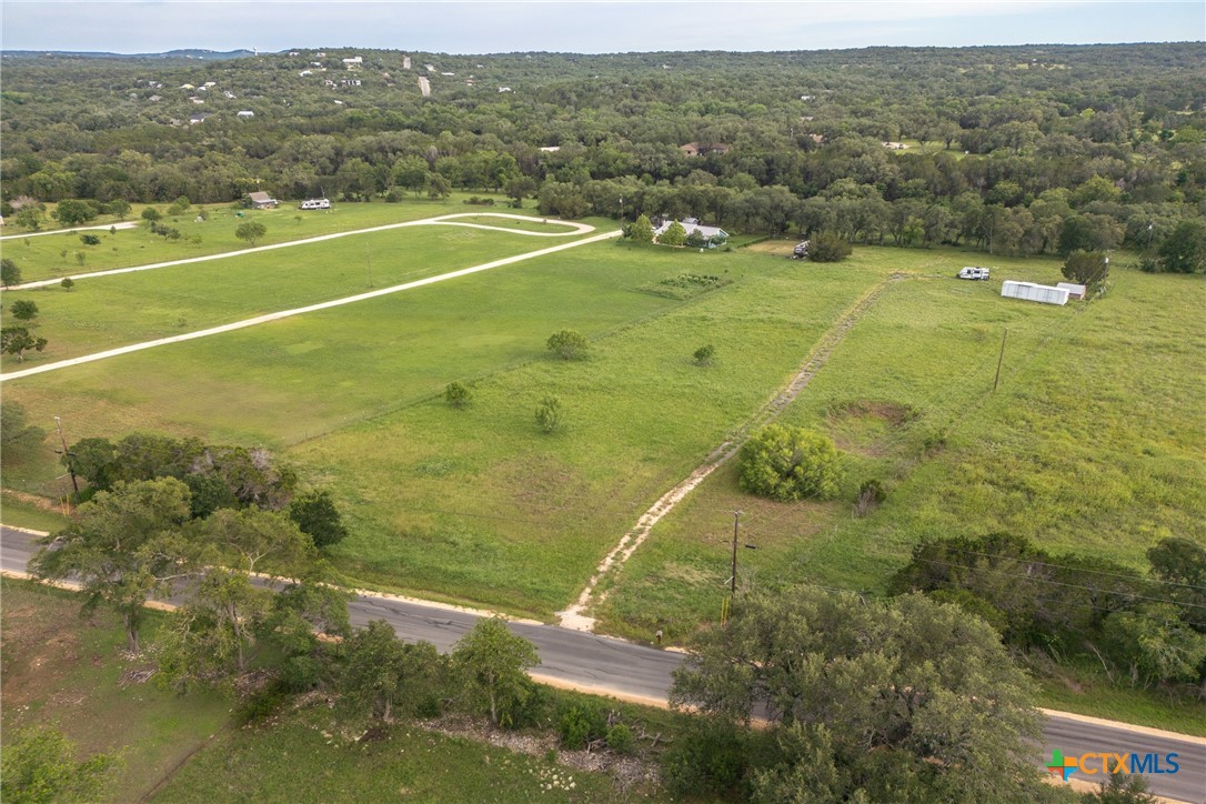 3411 Mail Rte Road Fischer, TX 78623 - Photo 8 of 12 a view of an outdoor space and a yard