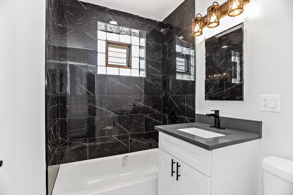a bathroom with a sink a vanity and a mirror