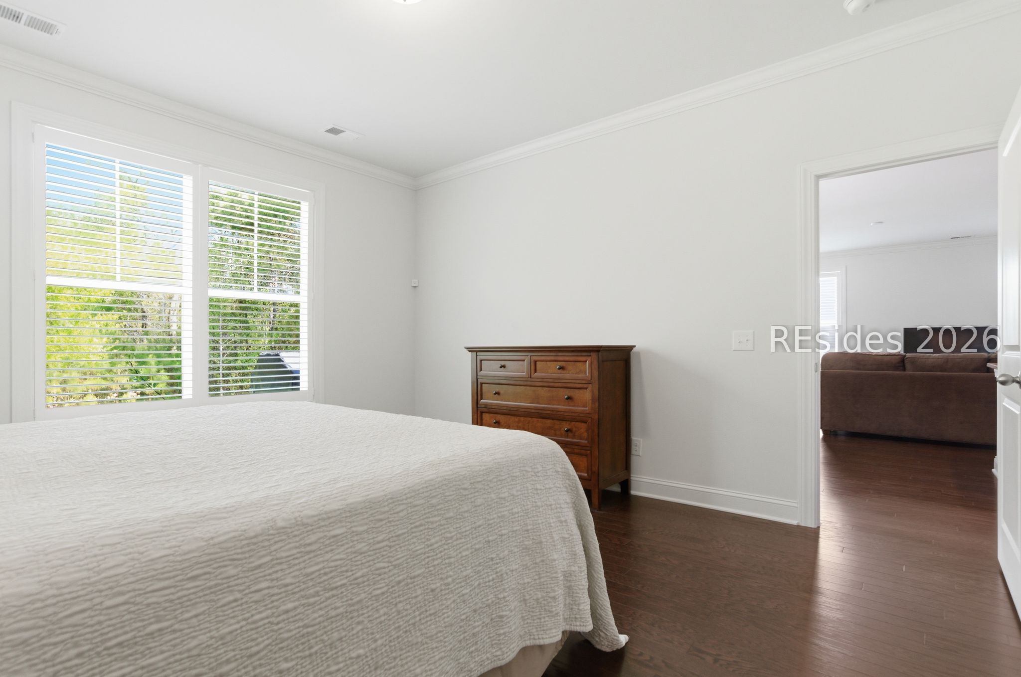 246 Lombards Mill Lane Bluffton, SC 29909 - Photo 18 of 33 Primary bedroom with hardwood floors.