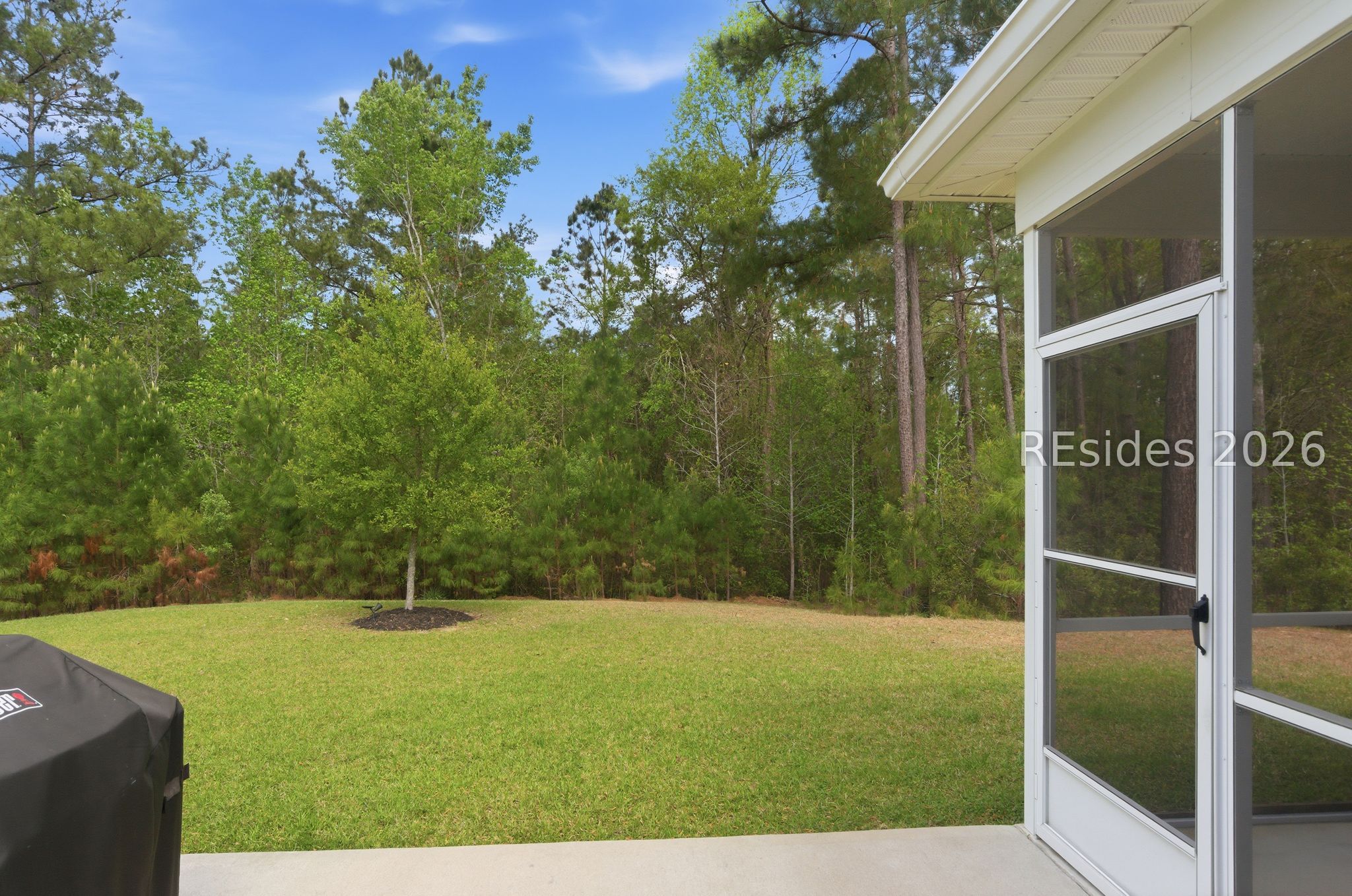 246 Lombards Mill Lane Bluffton, SC 29909 - Photo 28 of 33 Patio, screened porch overlooking large back yard
