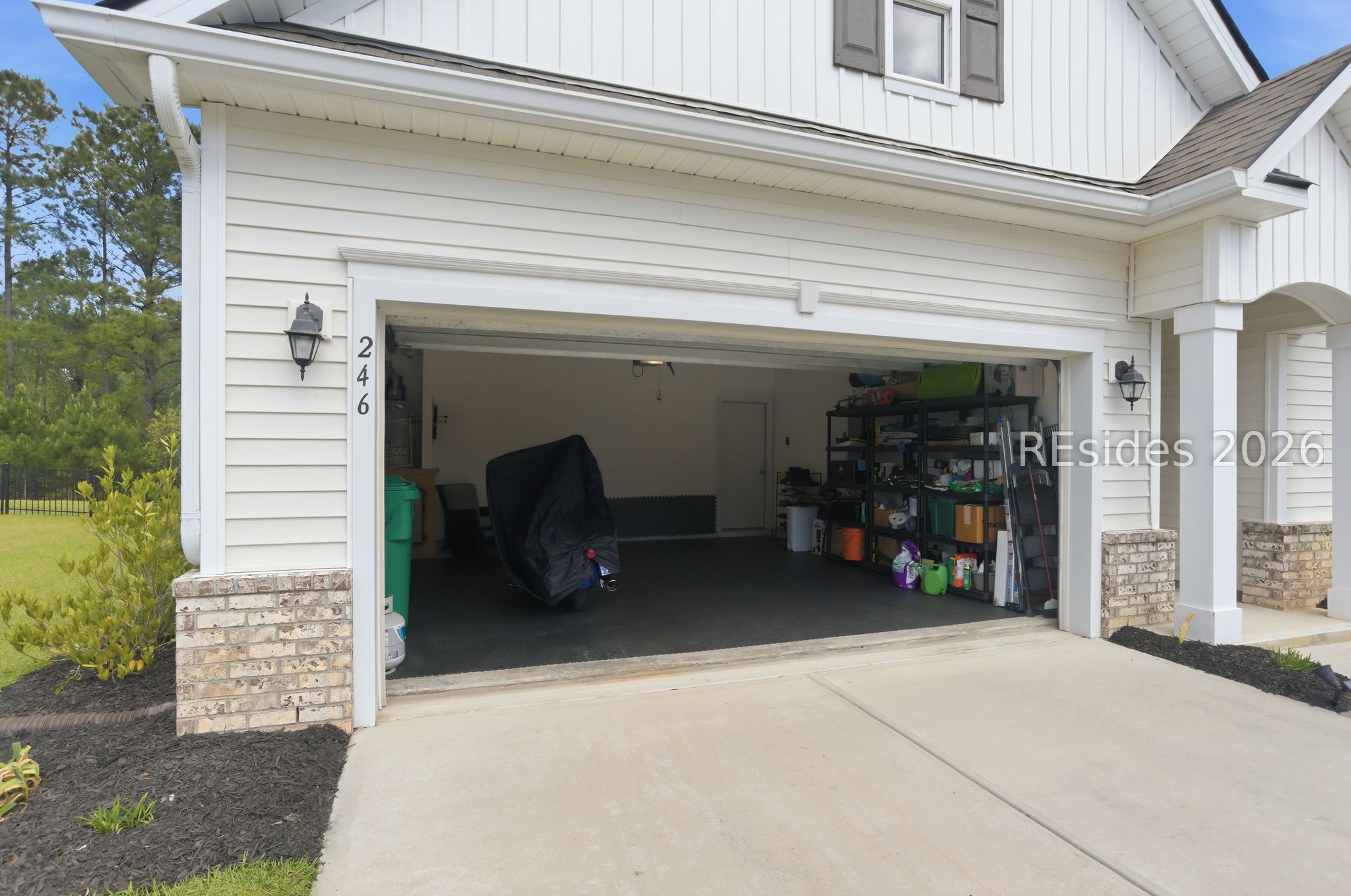 246 Lombards Mill Lane Bluffton, SC 29909 - Photo 33 of 33 Two gar garage with rubber matting.