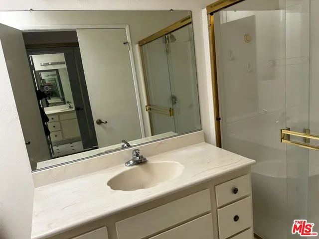 a bathroom with a sink and mirror