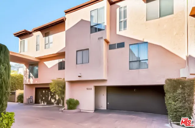 a front view of a building with garage