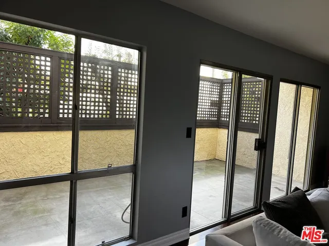 a view of a glass door with a glass windows