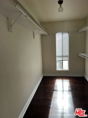 a view of an empty room and glass windows