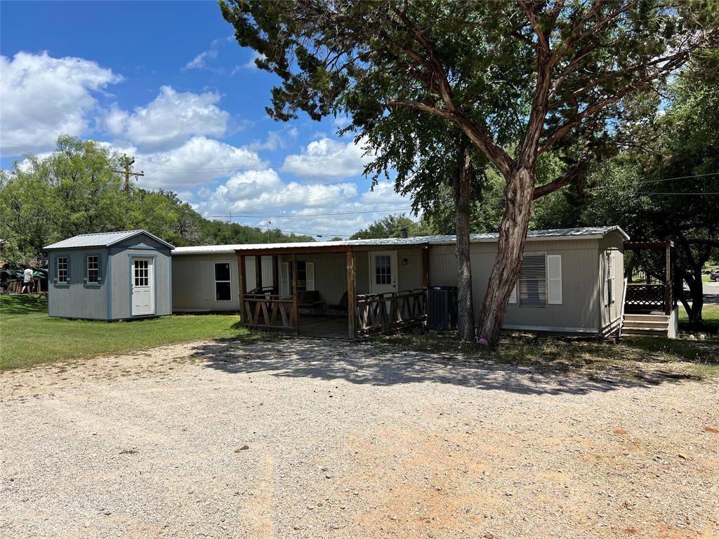 2334 San Bar Road, Unit 46 Graford, TX 76449 - Photo 30 of 37 a view of a house with a yard covered in snow