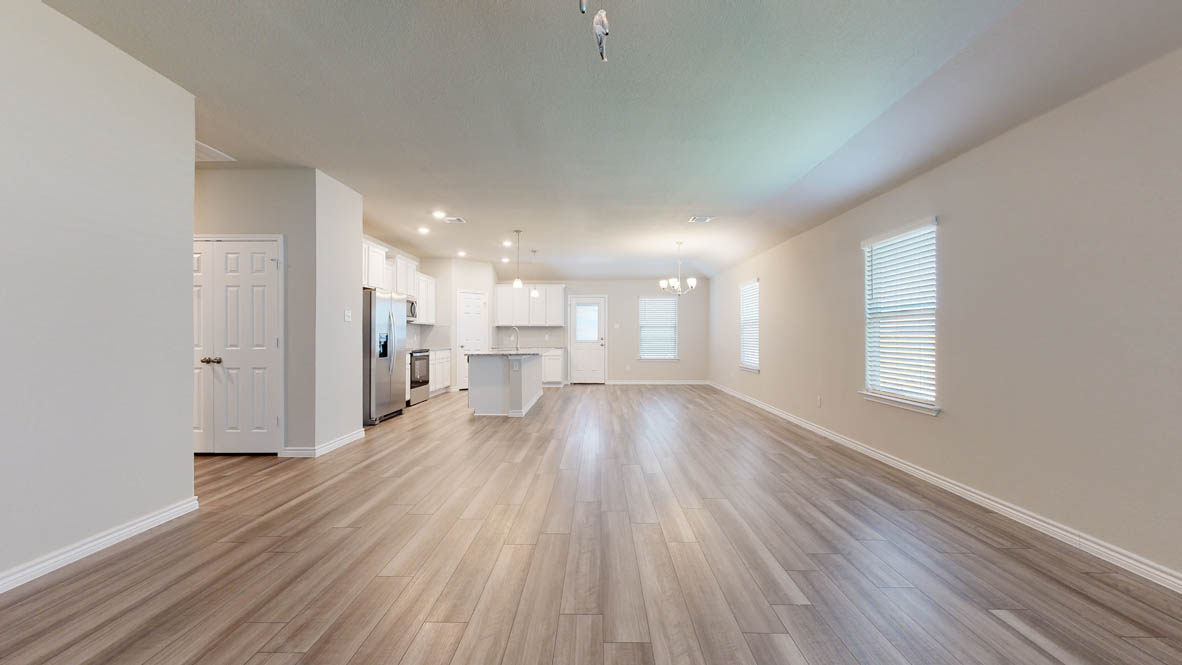 104 Kenzie Street Thorndale, TX 76577 - Photo 9 of 28 a view of empty room with wooden floor