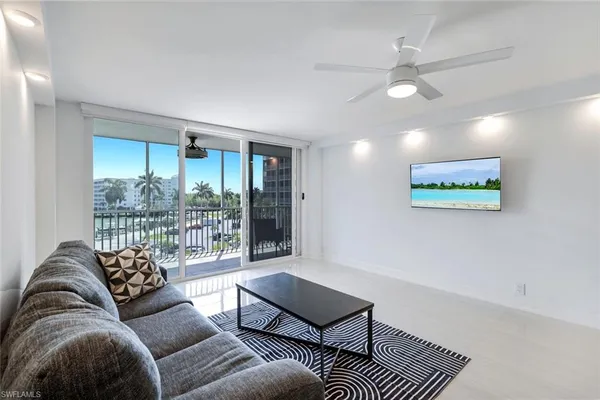 a living room with furniture and a large window
