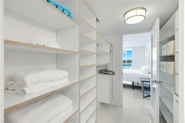 a living room with furniture and white walls