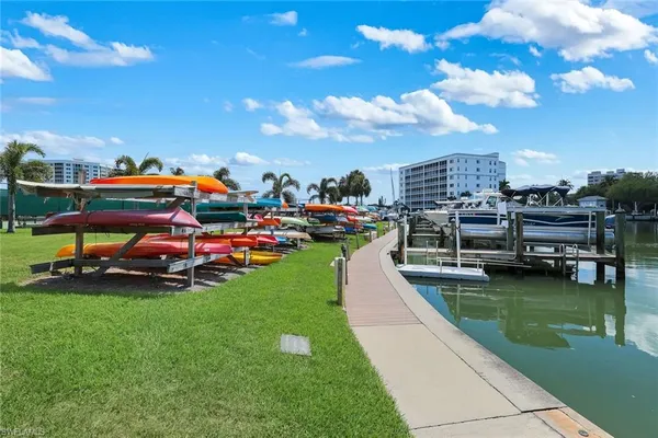 a view of yard with swimming pool and seating