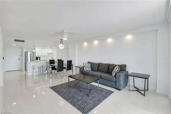 a living room with furniture and a table