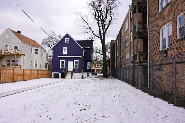 a front view of a building with a snow in front of it