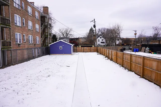 a view of a terrace with tall buildings