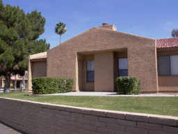 3511 East Baseline Road, Unit 1003 Phoenix, AZ 85042 - Photo 1 of 4 a front view of a house with a yard