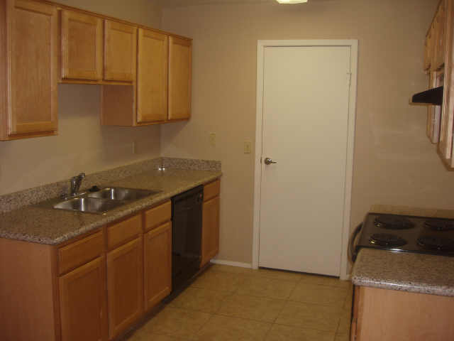3511 East Baseline Road, Unit 1003 Phoenix, AZ 85042 - Photo 2 of 4 a kitchen with a sink and cabinets