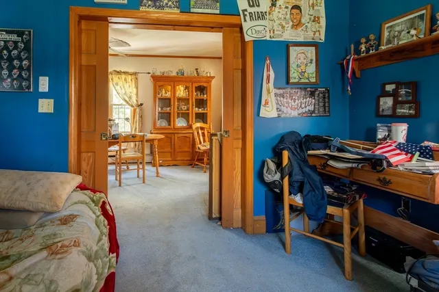 a bedroom with a bed and a table in it