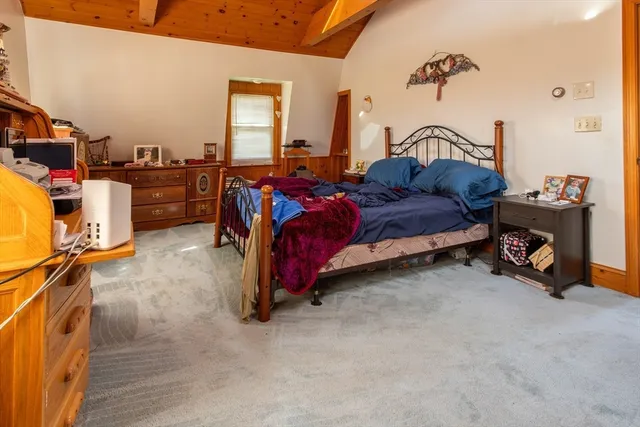 a bed room with a bed and a couch