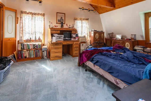 a bed room with a bed and furniture